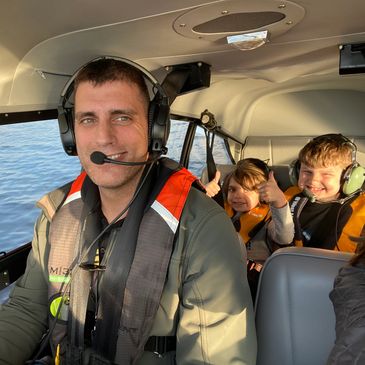 Jonathan Groner, seaplane training instruction takes his kids for a ride on the North East Cape Fear