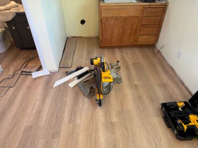 Miter saw on new hardwood floor installation.