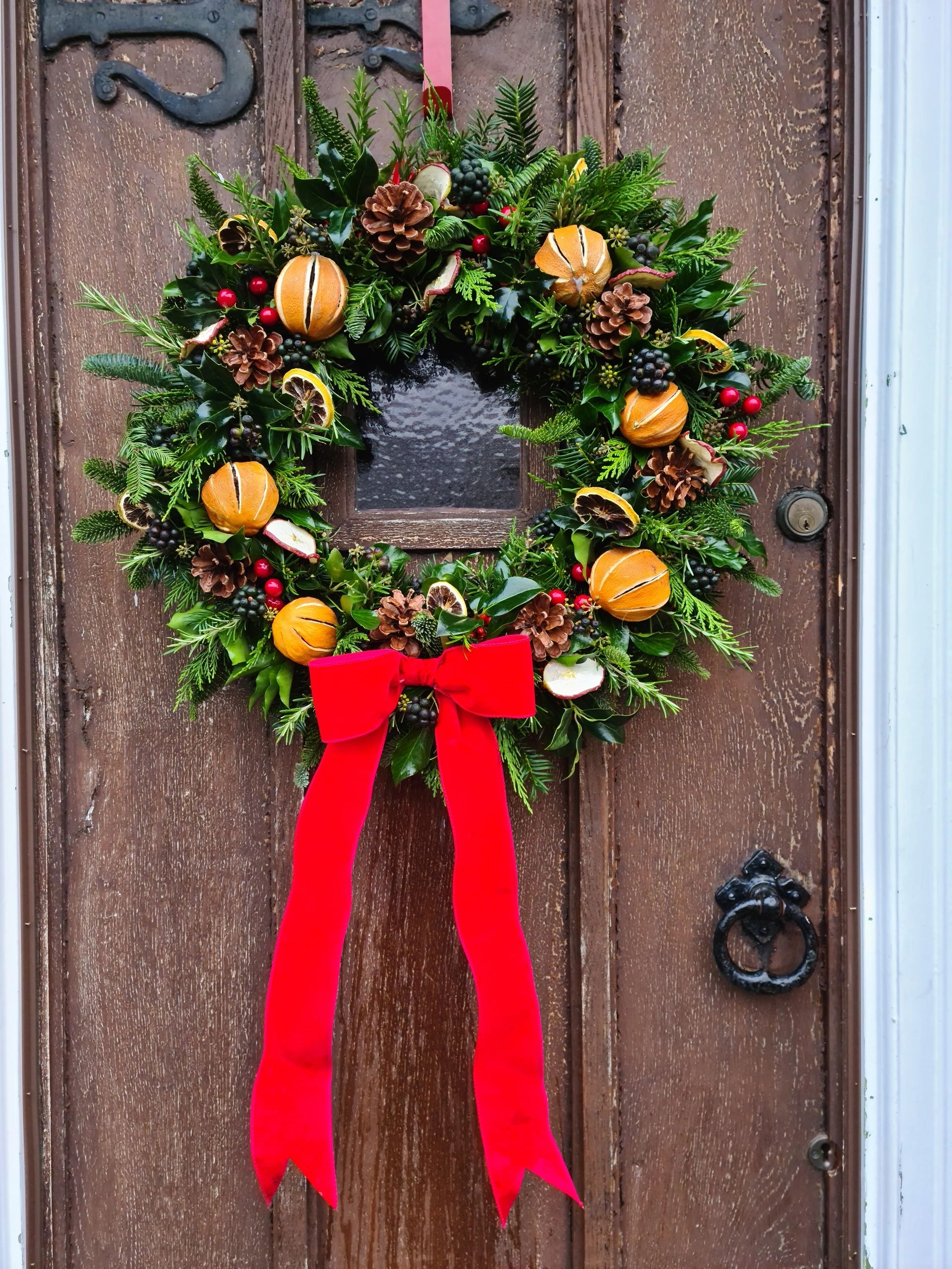 Luxury Christmas Wreath complete with pinecones and whole oranges, fruit slices and berries