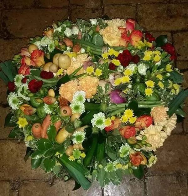 Allotment Wreath full of Grandads Vegetables and fresh flowers. 
