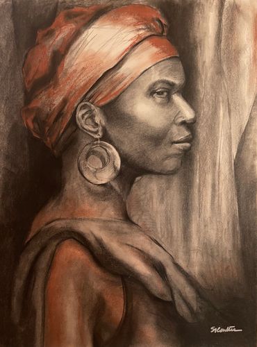 Profile portrait of a woman wearing a headscarf and large earrings in warm tones.