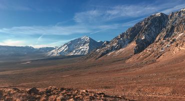 Snow capped mountain and desert land in Mt. Gabb, California 