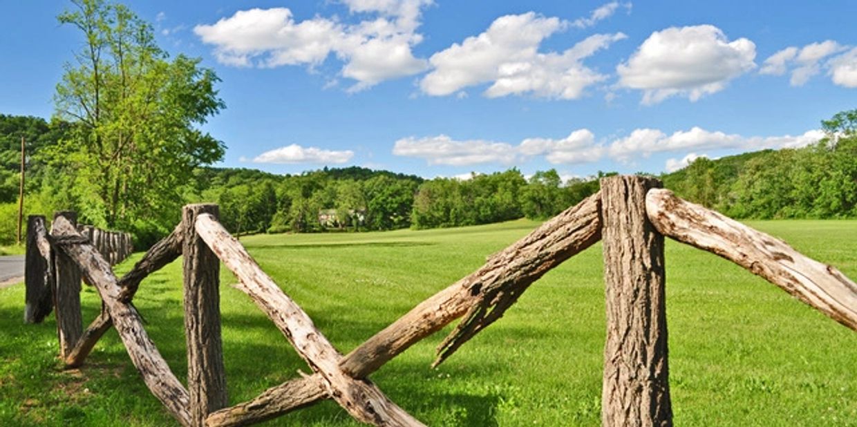 Land enclosed with a wooden barricade