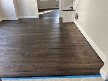 professional flooring stain services that enhance the natural beauty of your hardwood floors. 