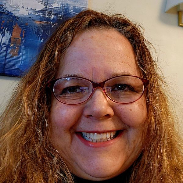 Healthy girl smiling with wearing eyeglass and looking ahead