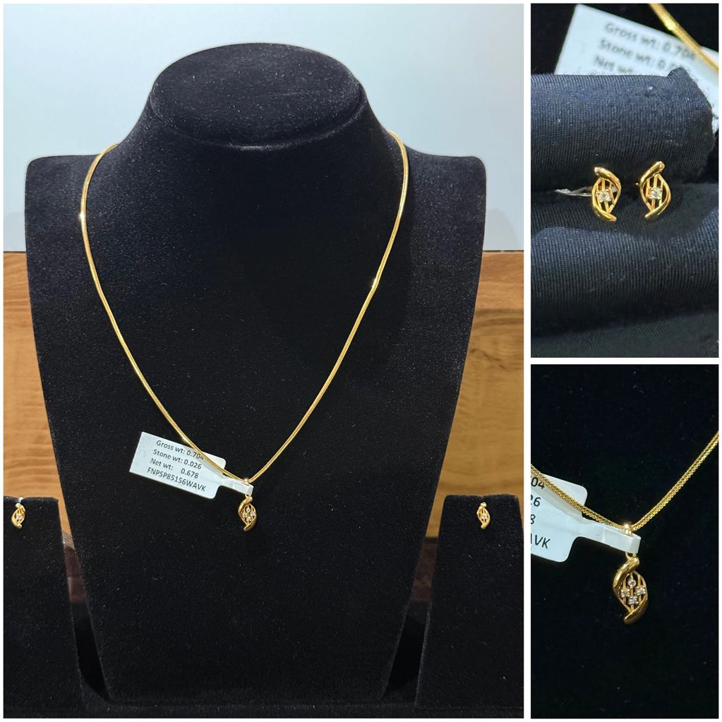 Gold necklace and earrings set with diamond accents displayed on black velvet.