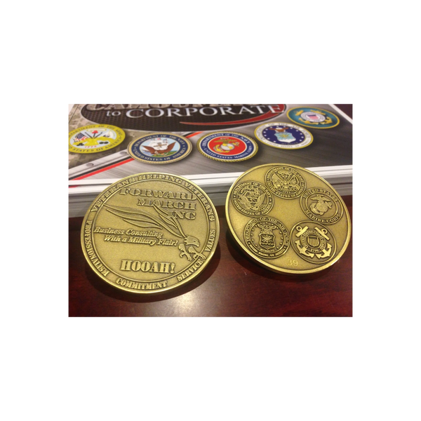 Two military challenge coins with various service emblems and inscriptions.