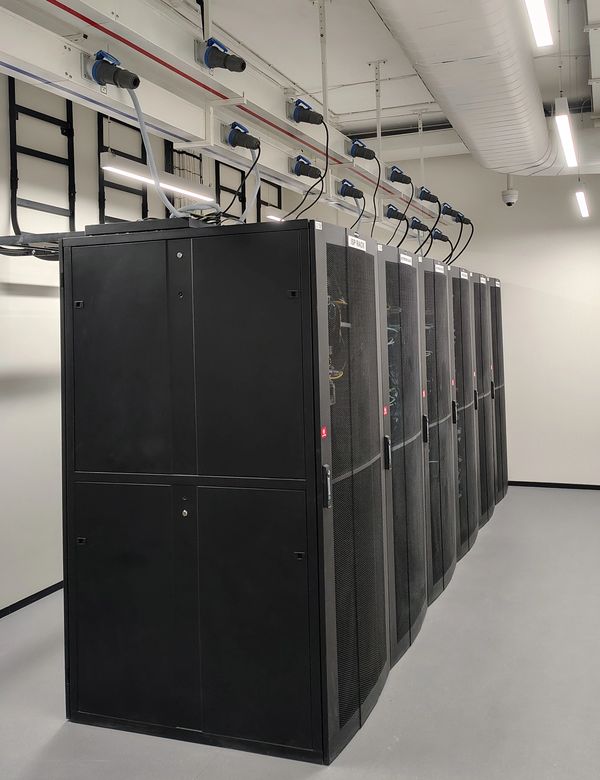 Row of black server racks in a data center.