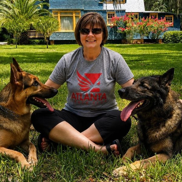 Alicia, retired law enforcement officer and founder of Max’s Pet Patrol with her German Shepherds
