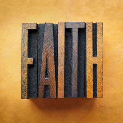 The word FAITH written in vintage letterpress type