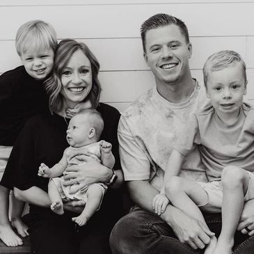 Happy family portrait with parents and three children.