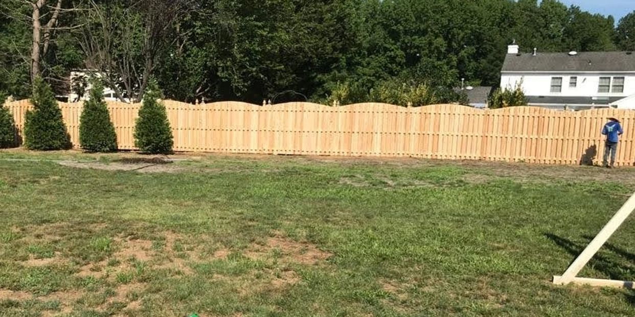 man working on a fence