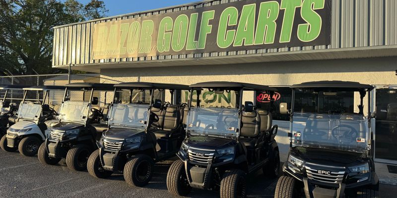 Lineup of golf carts outside Razor Golf Carts store
