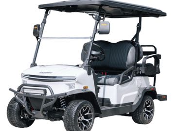 Modern white golf cart with black roof and stylish wheels.