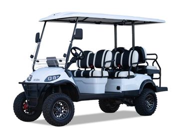 White and black six-seater golf cart with rugged tires and roof.
