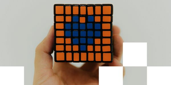 Rubik’s cube displaying a heart shape—representing problem-solving with empathy and precision.