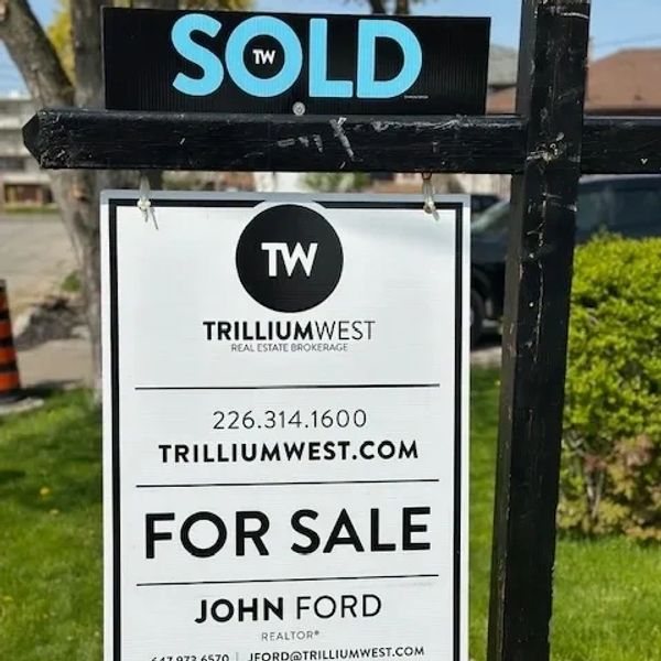 Real estate sign for John Ford at Trillium West, marked sold.