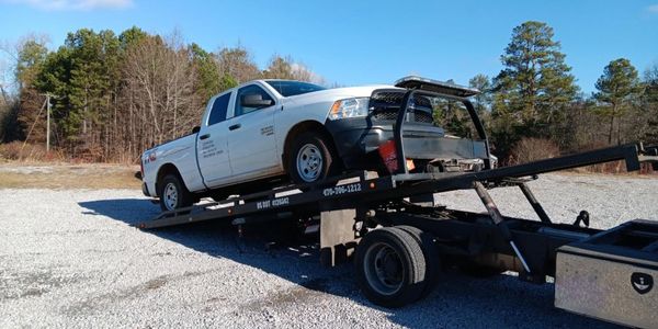 white pick up truck towing