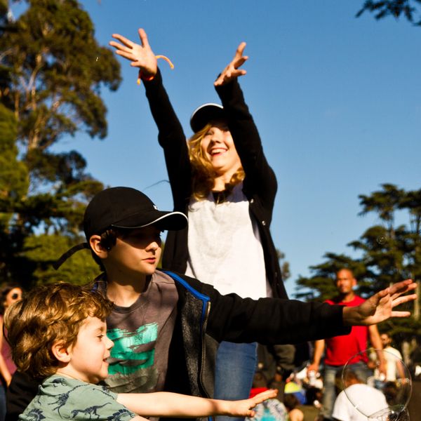 a person and two children in a park