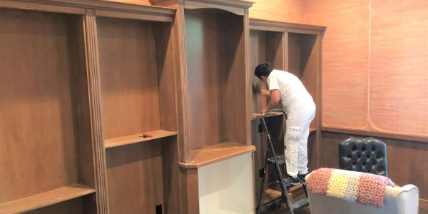 preparing a entertainment center for painting Winter Park, Fl 32789