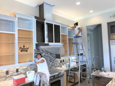 crew preparing kitchen cabinet for painting Windermere, Fl 34786