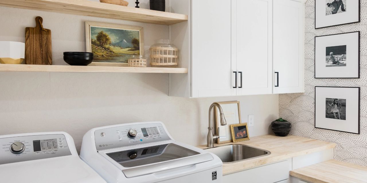 Organized home laundry room with cabinets, counter space, and practical storage designed for everyday convenience.