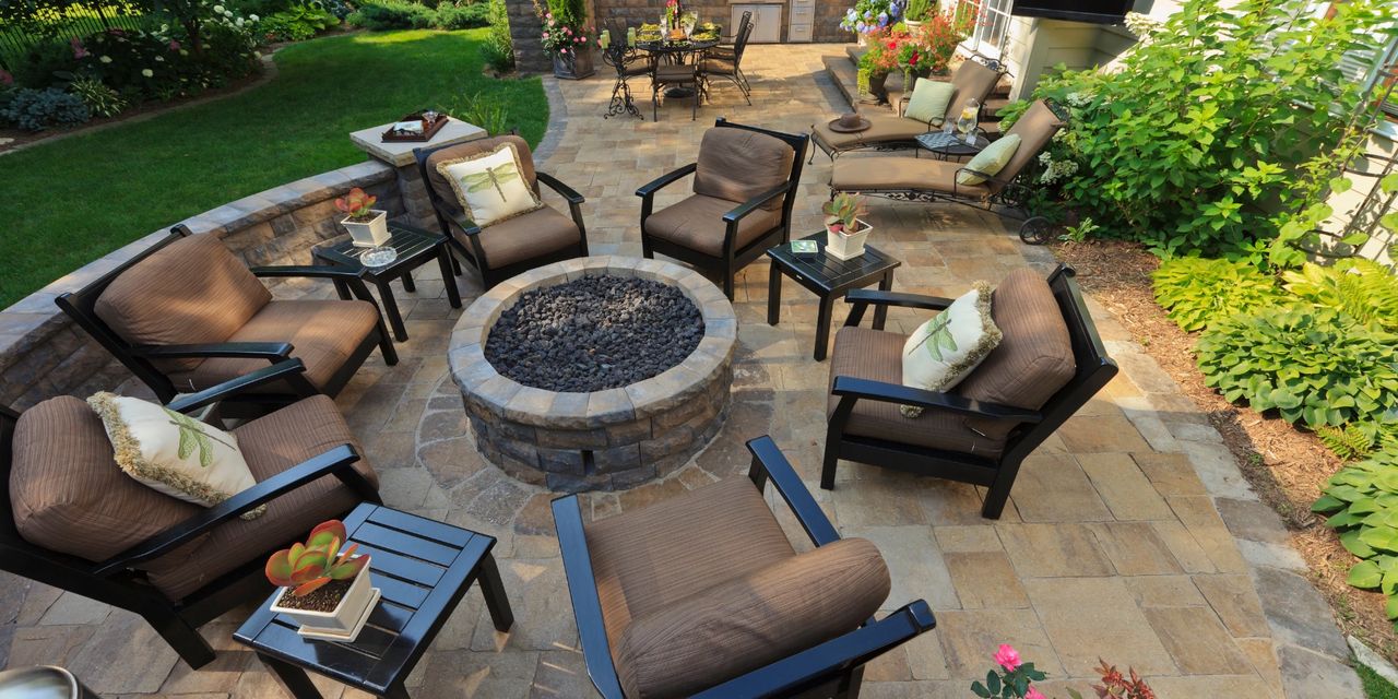 Usable backyard with patio, lawn, privacy, and outdoor seating offering functional living space for homeowners.