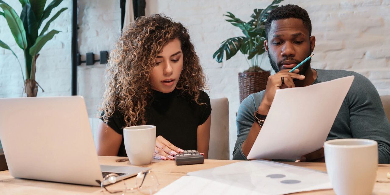Homeowner comparing the financial costs of waiting until spring with selling a home during the current West Michigan real estate market Homeowner comparing the financial costs of waiting until spring with selling a home during the current West Michigan real estate market