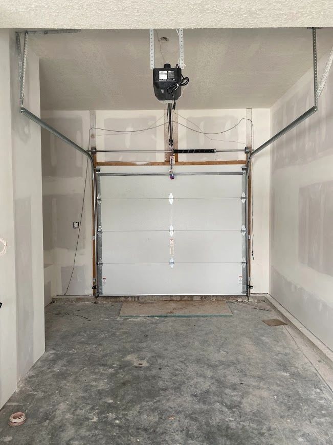 Garage door cable repair with door properly balanced