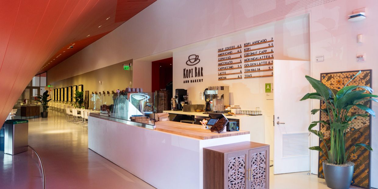 Modern coffee bar with minimalist design and wooden accents.