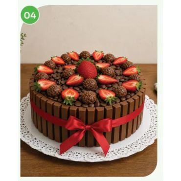 Chocolate cake decorated with strawberries and KitKat bars.