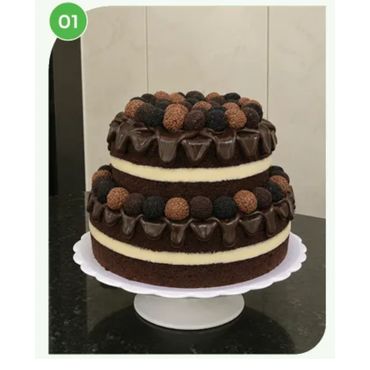 Two-tiered chocolate cake with cream and truffles.