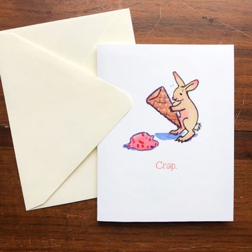 Greeting card of a bunny who's dropped his ice cream, responds "CRAP".  Created by JENNIFER HALL.