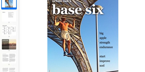 Man doing pull-ups on a metal structure under clear blue sky.