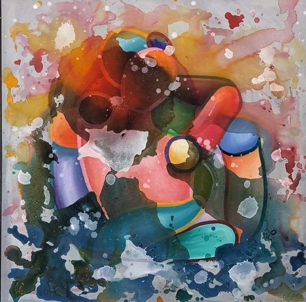 A couple kiss with splashed and dripped paint surrounding them.