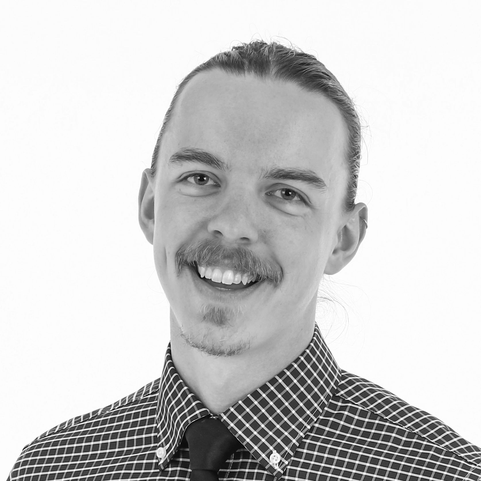 Benji Wittman, MBA, CPTM,  Headshot. 