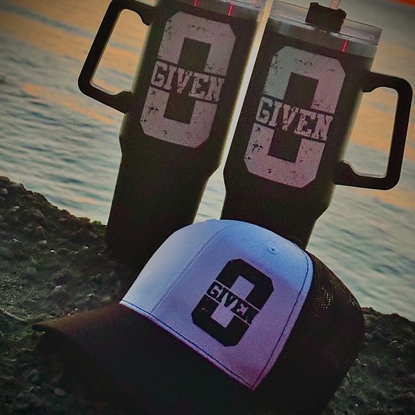 Two bottles and cap kept on the shore of beach