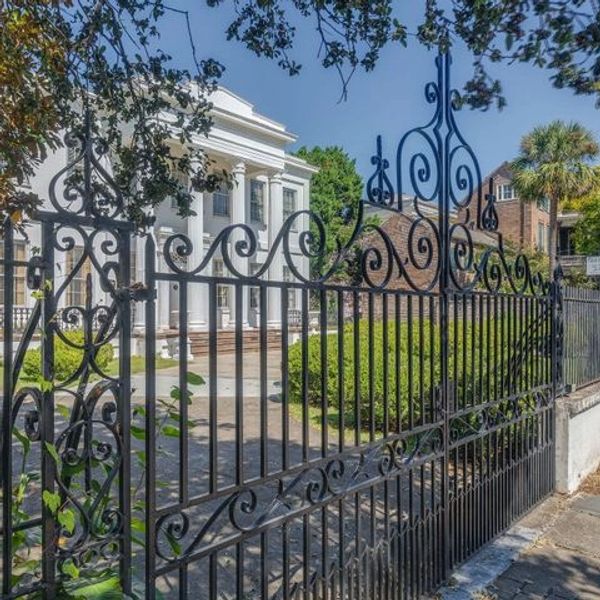 Wentworth mansion that we sold. Philip Simmons gates providing access to driveway. 