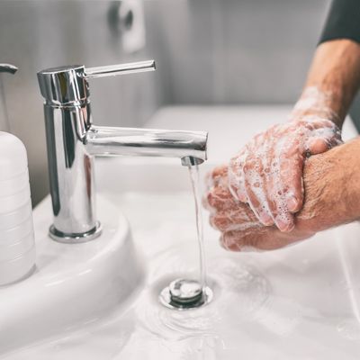 Plumber washing hands