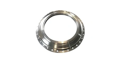 A shiny metallic circular flange with multiple holes around its perimeter.