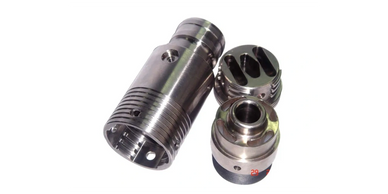 Three metal mechanical components with precise machining details.