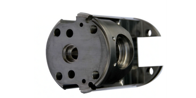 Close-up of a precision-machined metal component with threaded openings.
