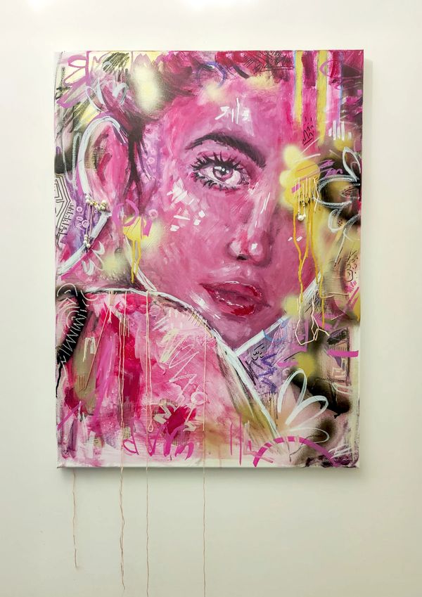 Vibrant pink portrait of a woman with expressive eyes and abstract graffiti elements.