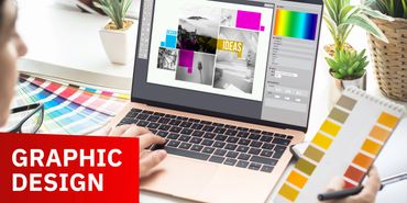 Person working on graphic design using a laptop and color swatches.