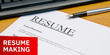 A resume document with a pen on a wooden desk, highlighting resume making.