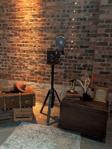 1920s vintage camera photobooth with period-style flash and vintage props at a Scottish wedding 