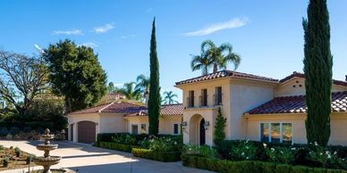 The front exterior of a Mediterranean style home.