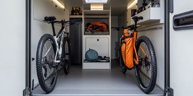 Storage compartment on a toy hauler 