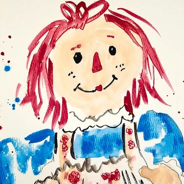 Raggedy Ann with red hair and blue top