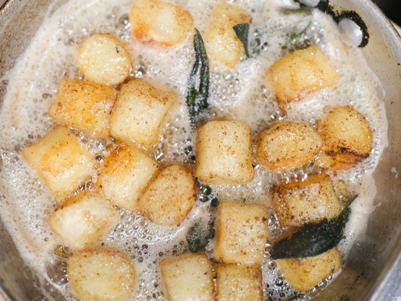 Golden pan-seared gnocchi cooked in butter at Alfredo's Pastaria and Mozzarella Bar.